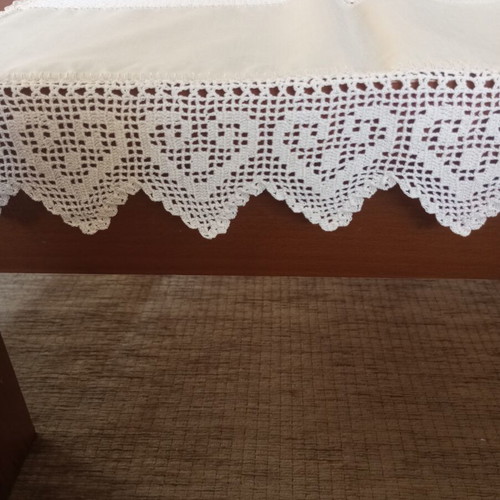 Beige hand-embroidered table runner with heart details