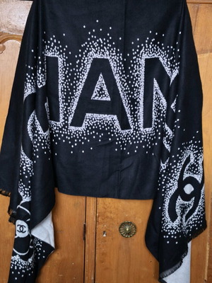 Chanel black scarf with white logo and Camellia motif like new