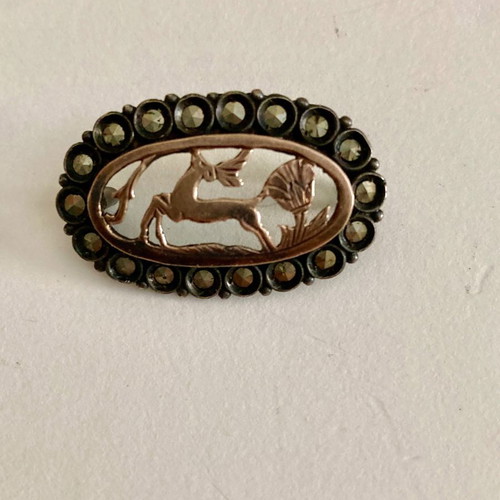 Silver brooch with gold and marcasites