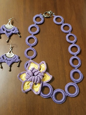 Handmade crochet necklace and earrings in purple with yellow daisy new