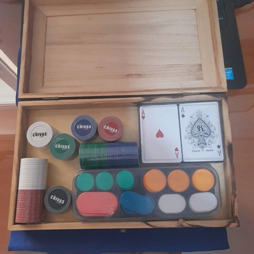 Chips and playing cards in case new pack