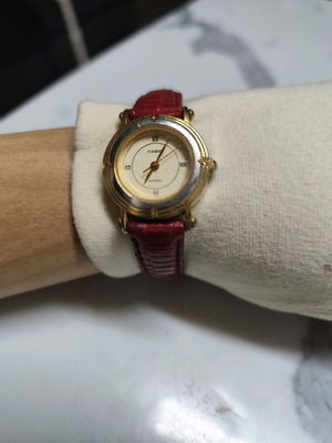 Casio LTP-1106 watch used, gold tone with red strap
