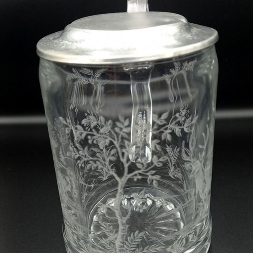 Glass beer mug with embossed hunting design like new from West Germany