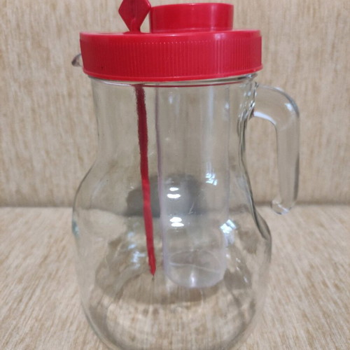 Glass pitcher large like new with ice compartment and stirrer