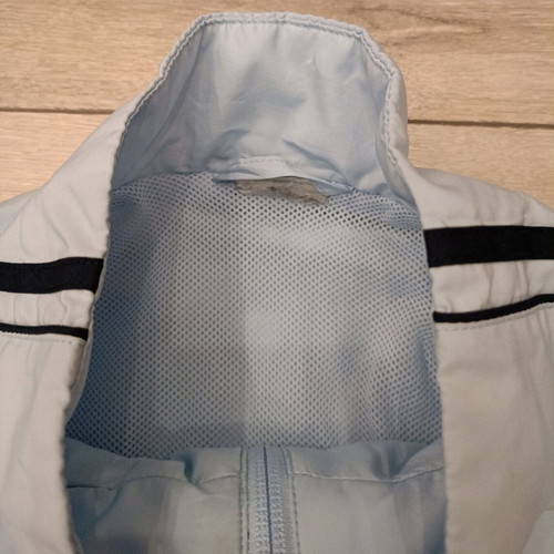 Vintage Nike windbreaker jacket used in ice blue with dark navy details