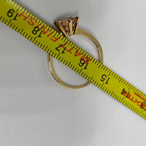 Ring with yellow gold finish and champagne stone, like new