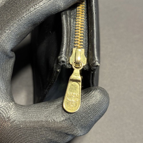MCM Monogram Mini Toiletry Bag used, black with gold zipper