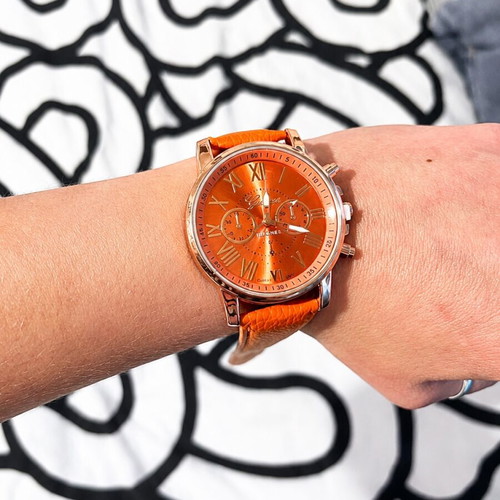 Unisex wristwatch new with orange synthetic leather strap