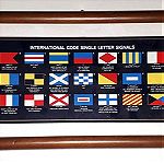  Κάδρο Διεθνούς Κώδικα - Αλφάβητου Ναυσιπλοΐας, με θαλάσσιες σημαίες γραμμάτων.