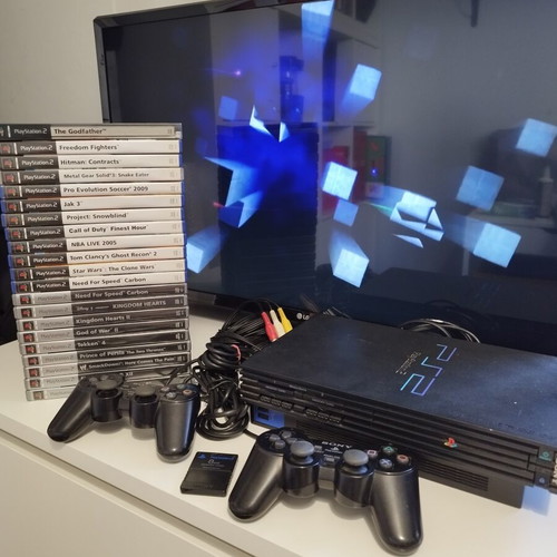 PlayStation 2 Fat console used with 2 controllers, memory card and 21 games