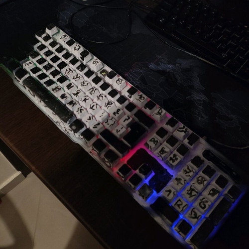 Keyboard and mouse used with Gran Turismo game
