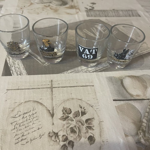 Whiskey Shot Glasses set of 4 like new, collectible labels