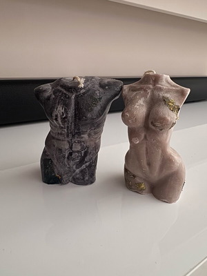 Set of soy candles shaped as female and male bodies like new