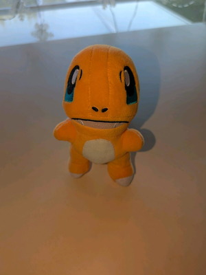 Charmander Plushie Pokemon used with tear on right arm