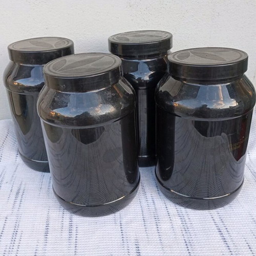 Plastic containers used, set of 4 with screw lid for food storage