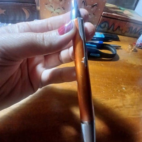 Parker pen like new, orange bronze color