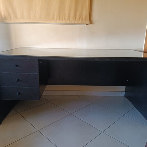 Black handmade wooden desk with glass top and 3 drawers
