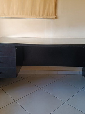 Black handmade wooden desk with glass top and 3 drawers