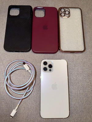 iPhone 12 Pro Silver 128GB used with charger and 3 cases