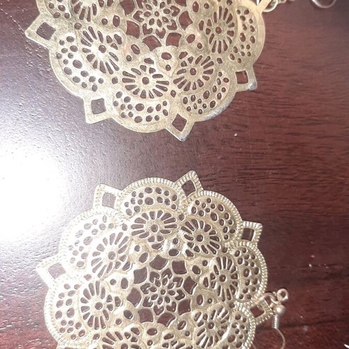 Large boho earrings used, gold color