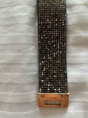 Bracelet with rhinestones used, black and silver with gold clasp