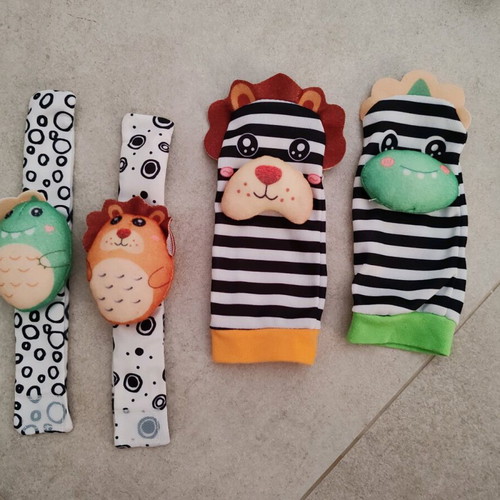Set of socks and wrist rattles Lazarid Lion and Dinosaur new
