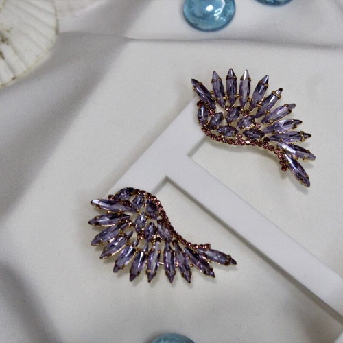 Earrings with purple stones angel wing design like new