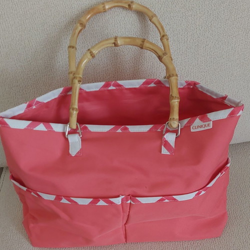 Clinique Limited Edition handbag, coral pink with white geometric pattern and bamboo handles