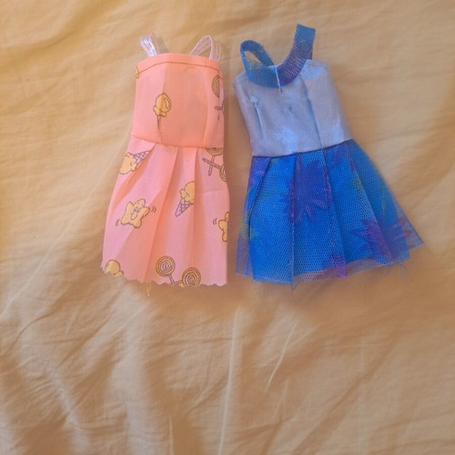 Doll dresses, one peach with ice cream pattern and one blue floral