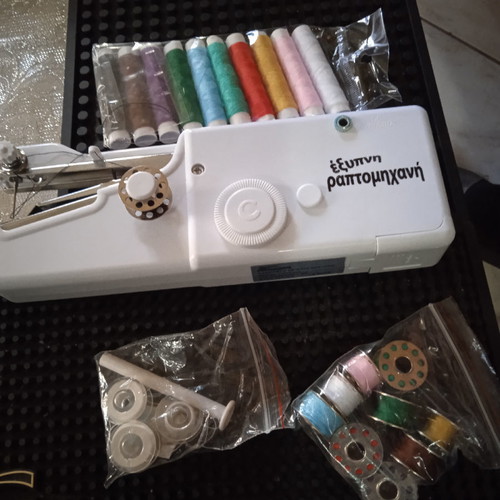Mini handheld sewing machine used with all accessories