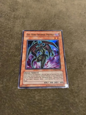 Evil Hero Infernal Prodigy used authentic Yu-Gi-Oh card
