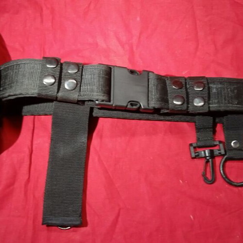 Tactical belt used, black cordura with quick-release buckle and holsters