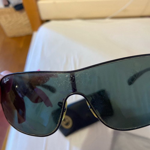 Rayban men's sunglasses used with small circular scratches