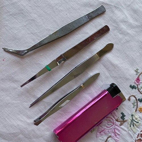 Tweezers set used, 4 different pieces