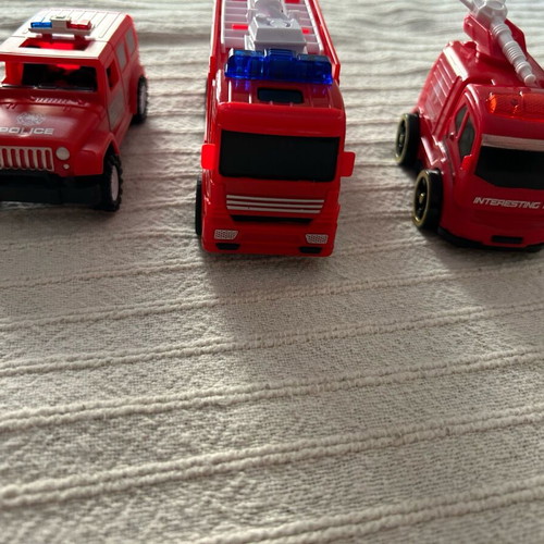 Various vehicles like new, 2 fire trucks and 1 police car