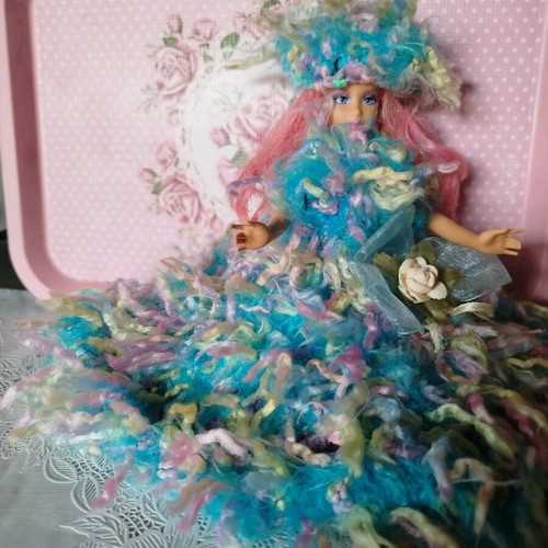 Doll with handmade dress and hat used