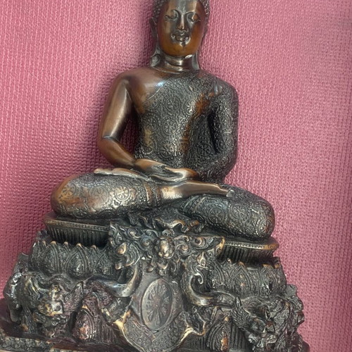 Thai Buddha statue with detailed embossed decoration
