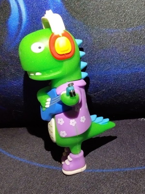Dinosaur figure with guitar keychain, like new