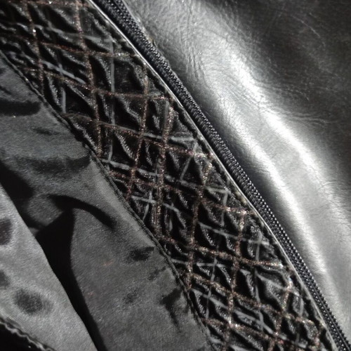 Black shoulder bag with embossed geometric pattern, like new