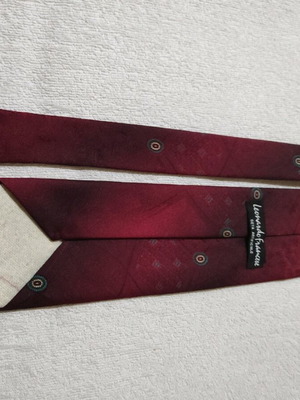 Red tie with patterns used