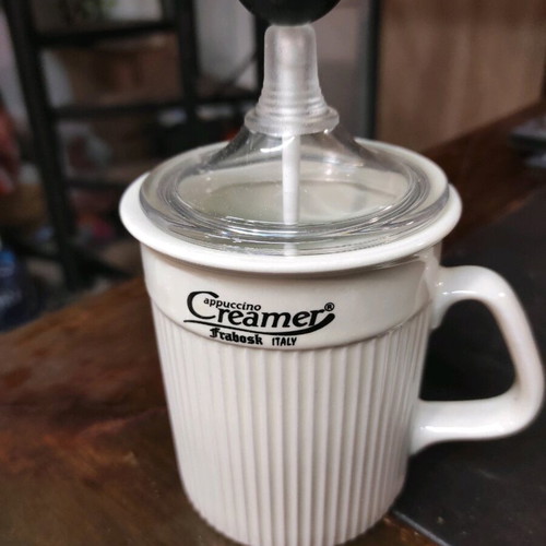 Cappuccino creamer used, porcelain