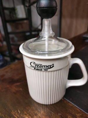 Cappuccino creamer used, porcelain
