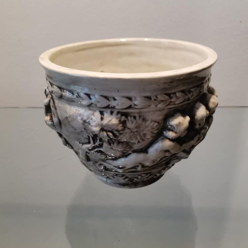 Faience cachepot used with embossed cherub design