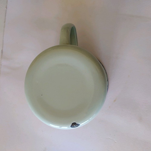 Enamel mug used, old with painted design