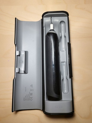 Oral-B Genius electric toothbrush with charging travel case used