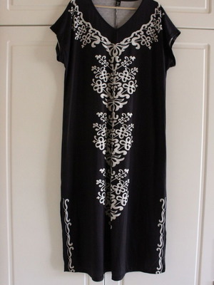 Black dress with white design like new