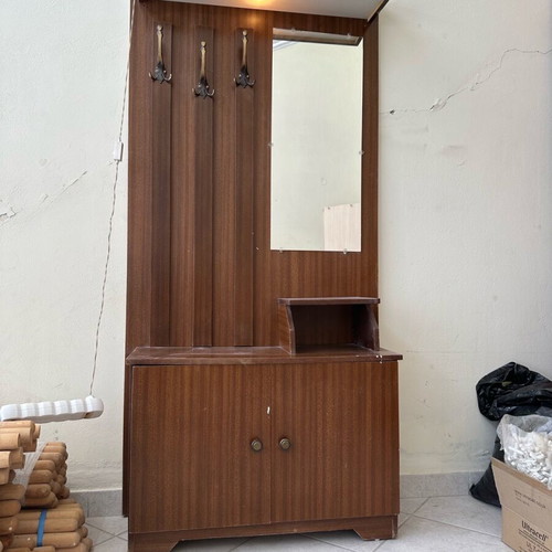 Vintage entrance furniture used with hooks, mirror and light