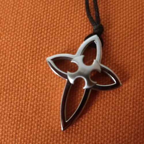 Pendant cross made of steel with cord in unique design like new