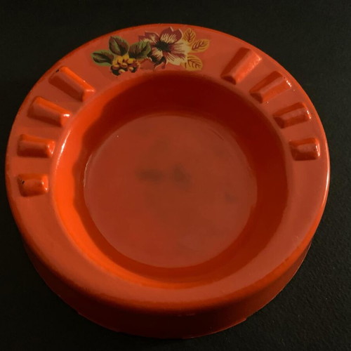 Vintage orange glass ashtray used