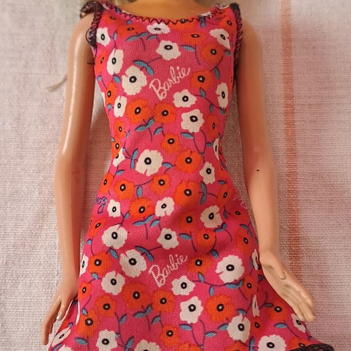 Barbie doll used with modern dress and painted cut hair